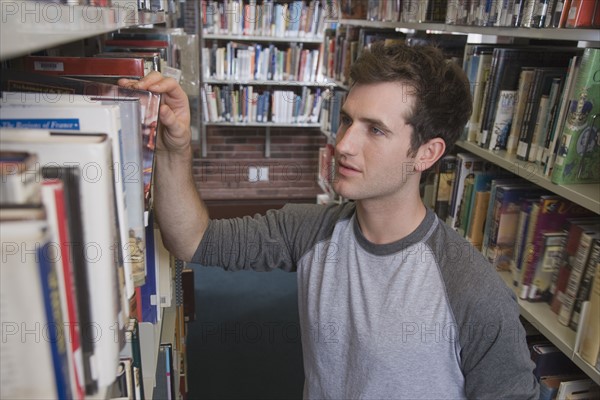 Young man in library.