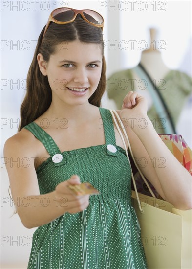 Girl paying with credit card.
