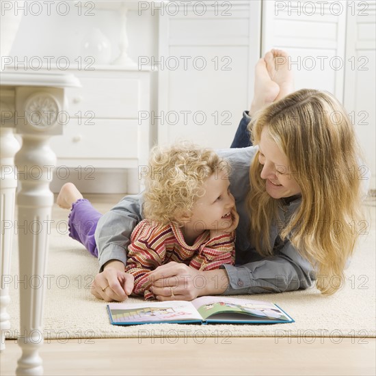 Mother and child reading. Date : 2006