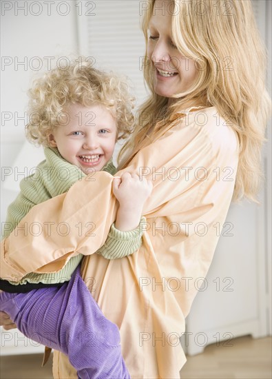 Portrait of mother holding child. Date : 2006