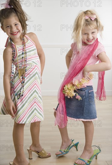 Two young sisters playing dress-up . Date : 2006