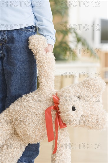 Close up of girl holding teddy bear. Date : 2006