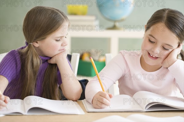 Two girls studying in classroom. Date : 2006