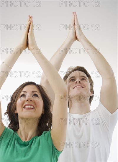 Couple practicing yoga. Date : 2007