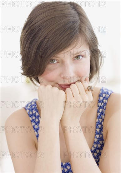 Woman leaning chin on hands. Date : 2007