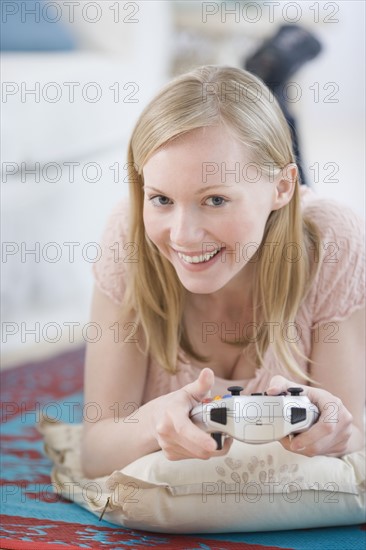 Woman playing video games. Date : 2007