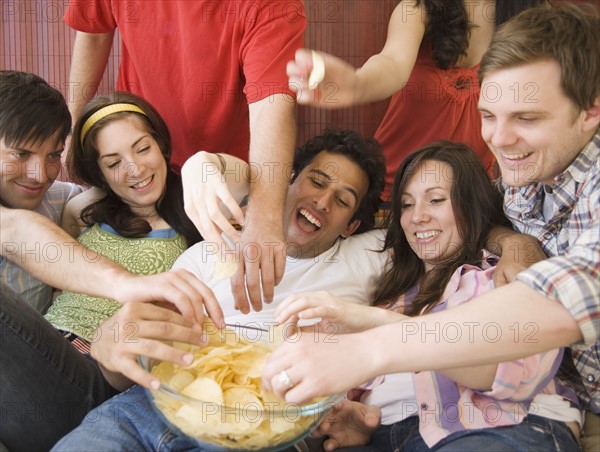 Friends eating chips. Date : 2007