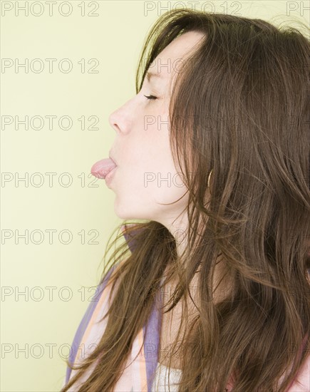 Woman sticking tongue out. Date : 2007