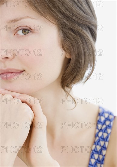 Woman leaning chin on hands. Date : 2007