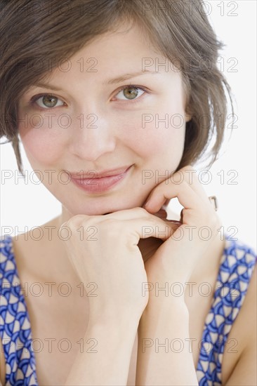 Woman leaning chin on hands. Date : 2007