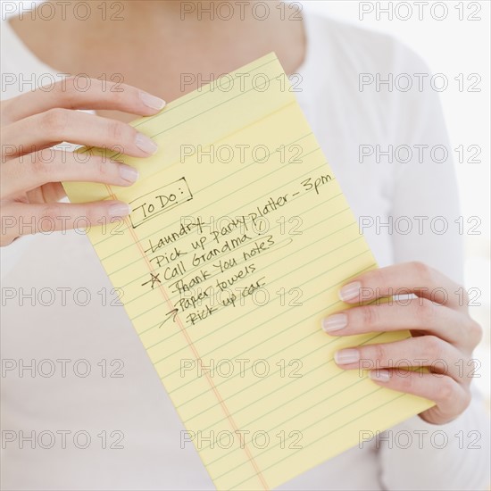 Woman holding To Do list. Date : 2007