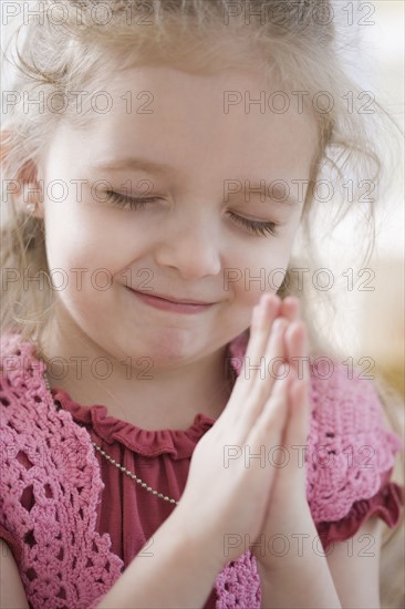 Close up of girl praying. Date : 2007