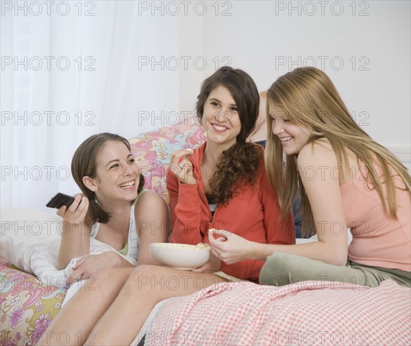 Teenage girls watching television. Date : 2007