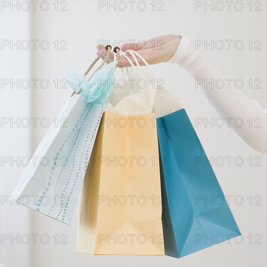 Woman holding shopping bags. Date : 2007