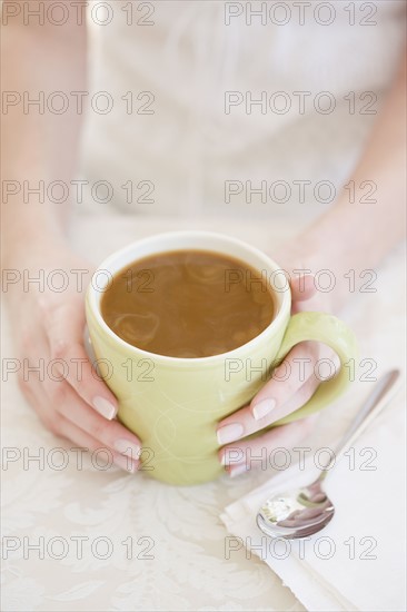 Woman drinking iced coffee. Date : 2007