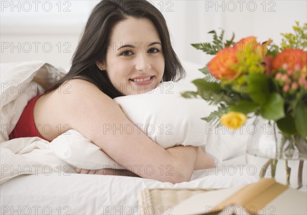 Portrait of woman laying in bed. Date : 2007