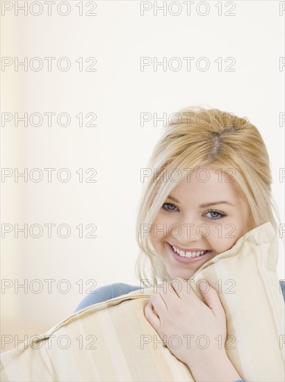 Woman hugging pillow. Date : 2007