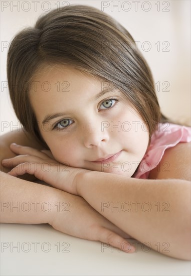 Portrait of girl leaning head on arms. Date : 2006