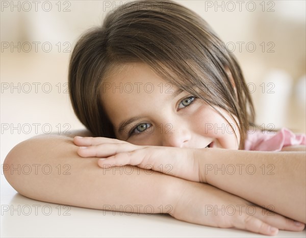 Portrait of girl leaning head on arms. Date : 2006