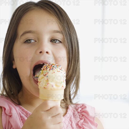 Close up of girl eating ice cream cone. Date : 2006