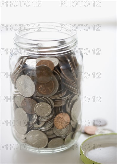 Close up of mason jar with change. Date : 2006