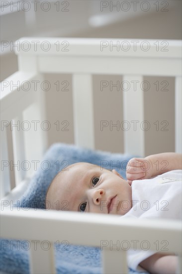 Baby laying in crib. Date : 2007