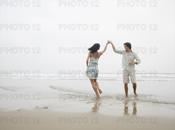 Couple dancing at beach. Date : 2006