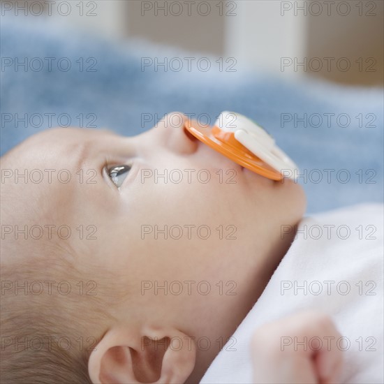 Close up of baby with pacifier. Date : 2007