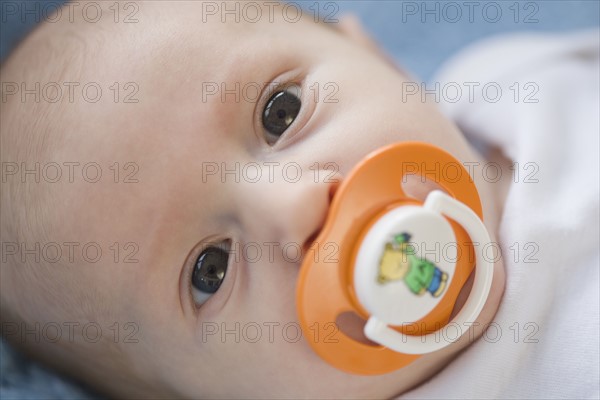 Close up of baby with pacifier. Date : 2007