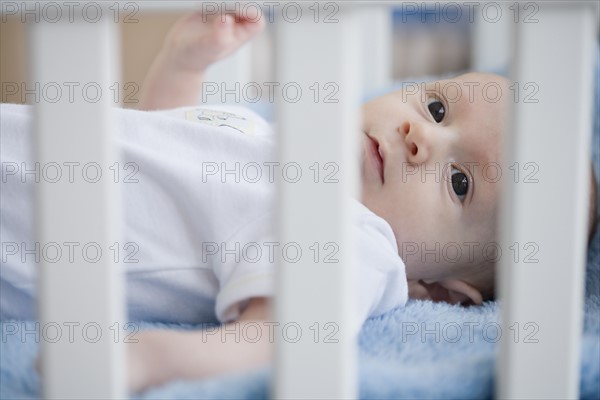 Baby laying in crib. Date : 2007