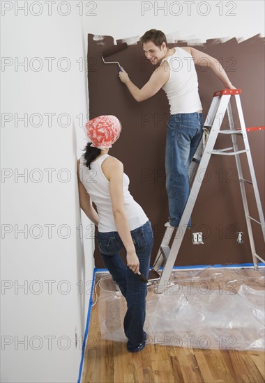 Couple painting indoors. Date : 2006