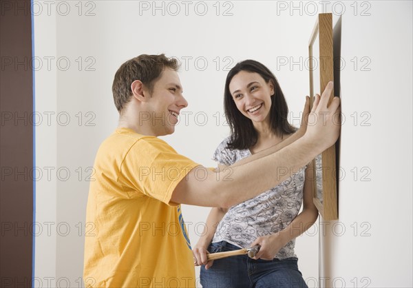 Couple hanging picture. Date : 2006