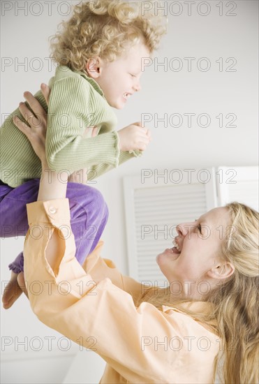 Mother playing with her daughter. Date : 2006