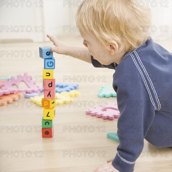 Toddler stacking blocks. Date : 2006