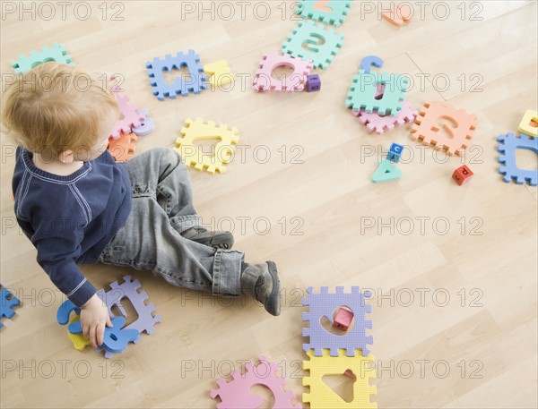 Young boy playing with toys. Date : 2006