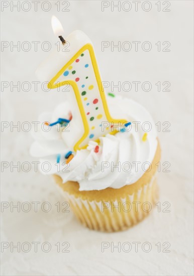 Still life of cupcake with one candle. Date : 2006