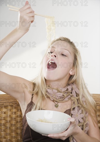 Woman eating noodles. Date : 2006