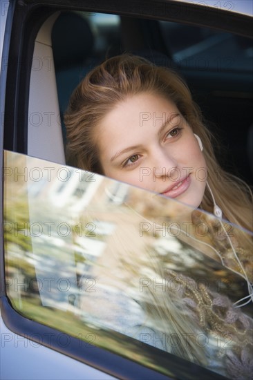 Female passenger sitting in car. Date : 2006