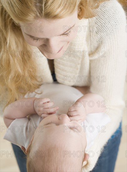 Mother smiling at baby. Date : 2006