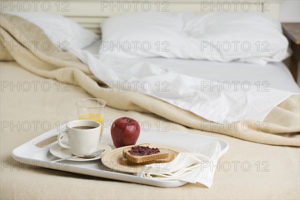 Still life of breakfast tray on bed. Date : 2006