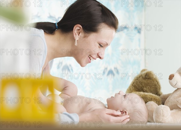 Mother smiling at baby. Date : 2006