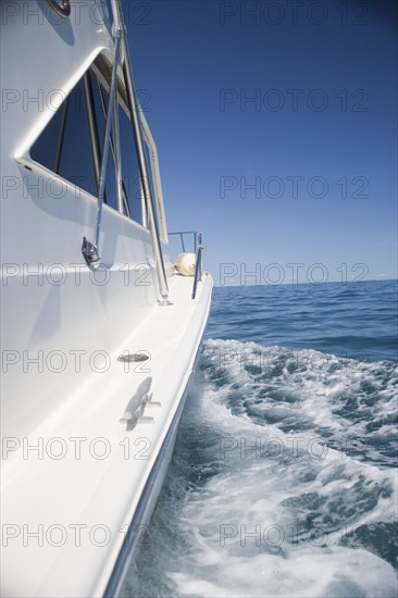 Side of a speed boat and its wake. Date : 2006