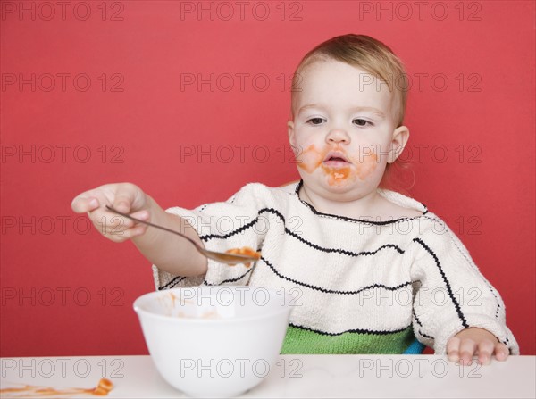 Female toddler eating. Date : 2006