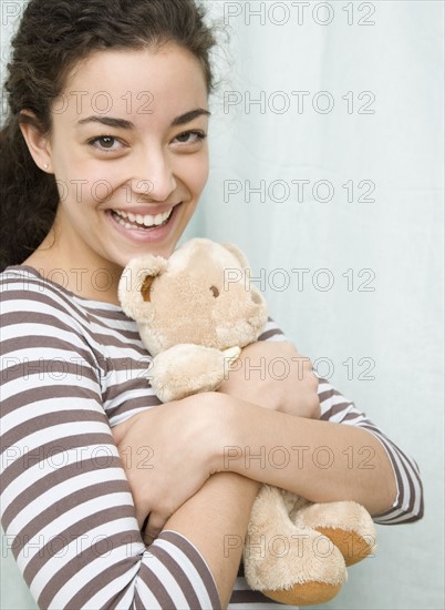 Woman hugging teddy bear. Date : 2007
