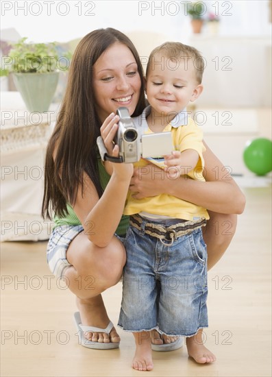 Mother and baby looking at video camera. Date : 2007