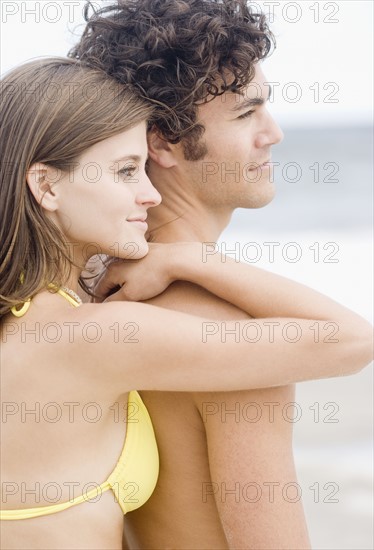 Couple hugging at beach. Date : 2007