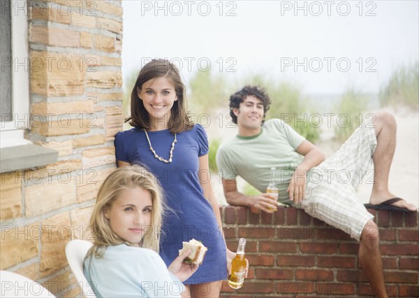 Friends drinking beer outdoors. Date : 2007