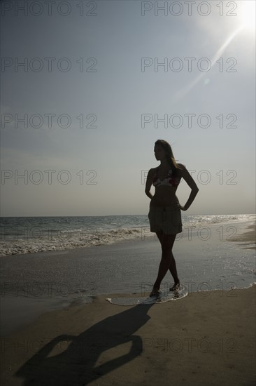 Woman walking on beach. Date : 2007