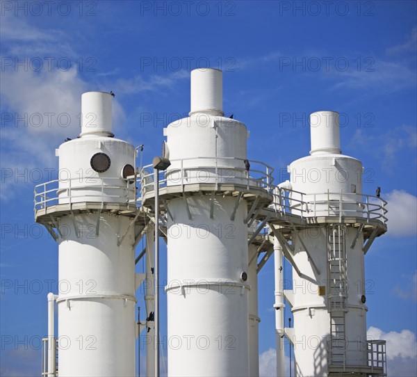 Metal silos under blue sky. Date : 2007