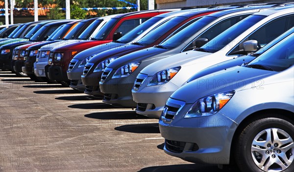 Row of new cars on lot. Date : 2007